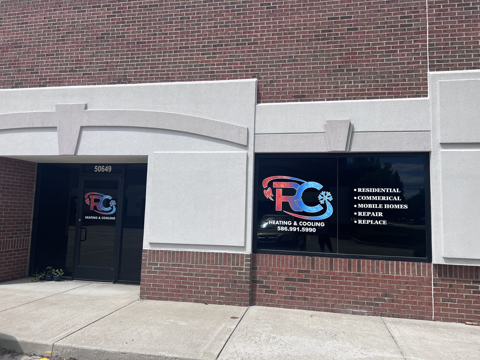 Front entrance of the RC Heating & Cooling office at 50649 Central Industrial Dr, Shelby Township, MI