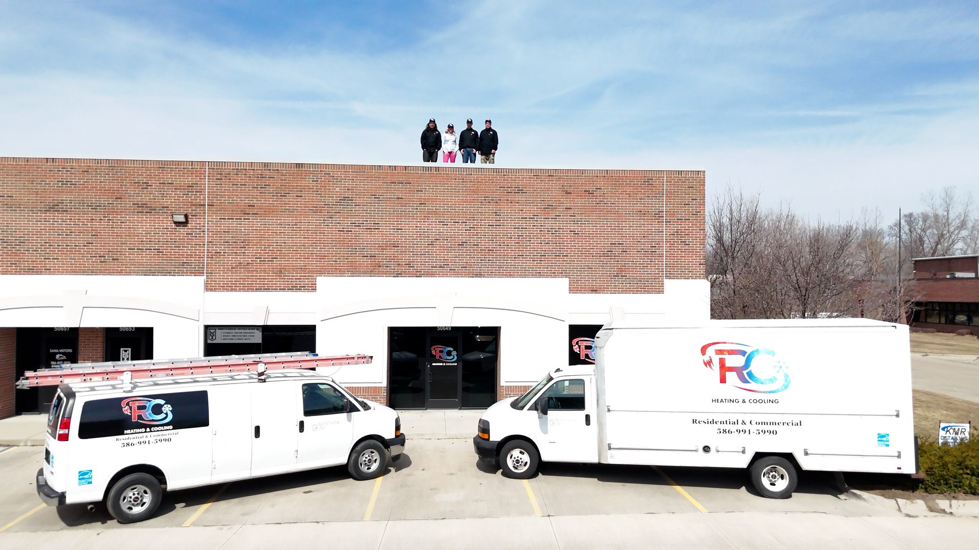 The RC Heating & Cooling team at their Shelby Township shop with the service trucks